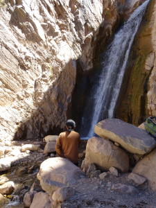 An woman sitting by the Cascade in the Devil's Throat