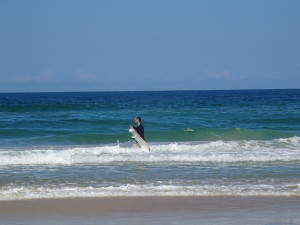 Mark wirh a big surf board